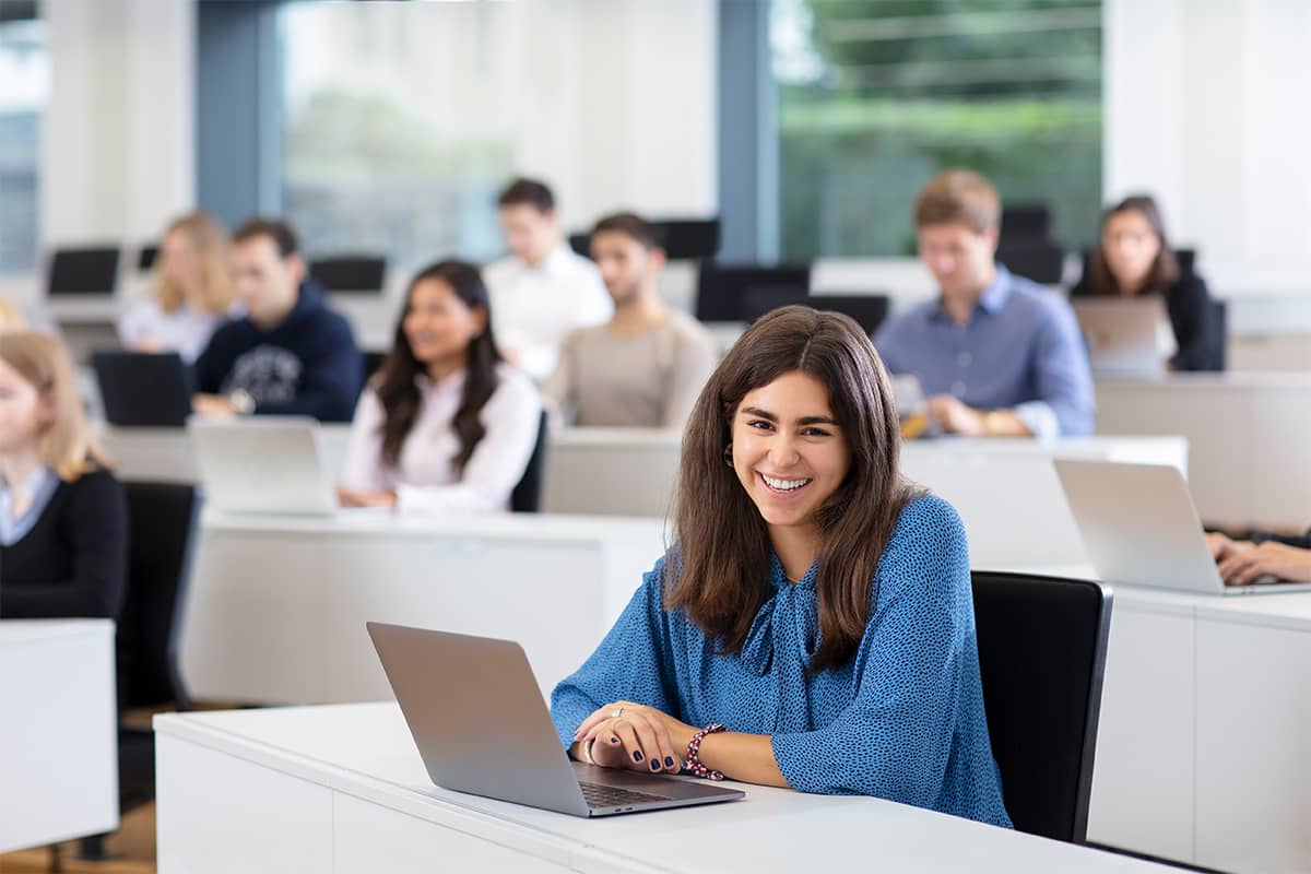 Female student smiles during a lecture